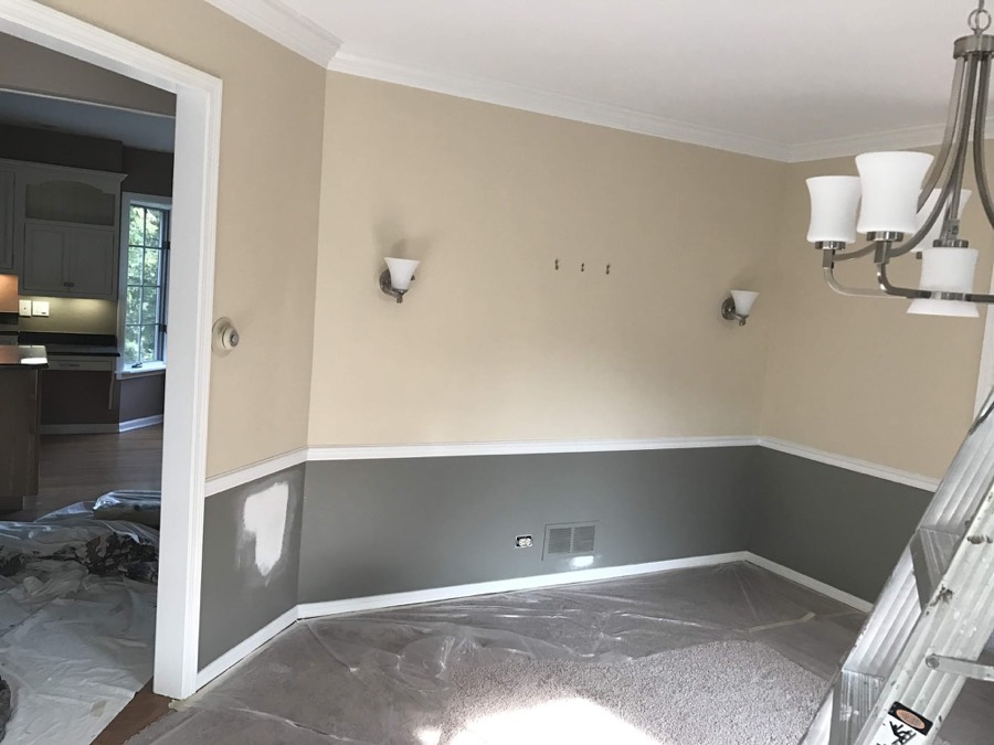 Two-tone dining room paint job with chair rail molding